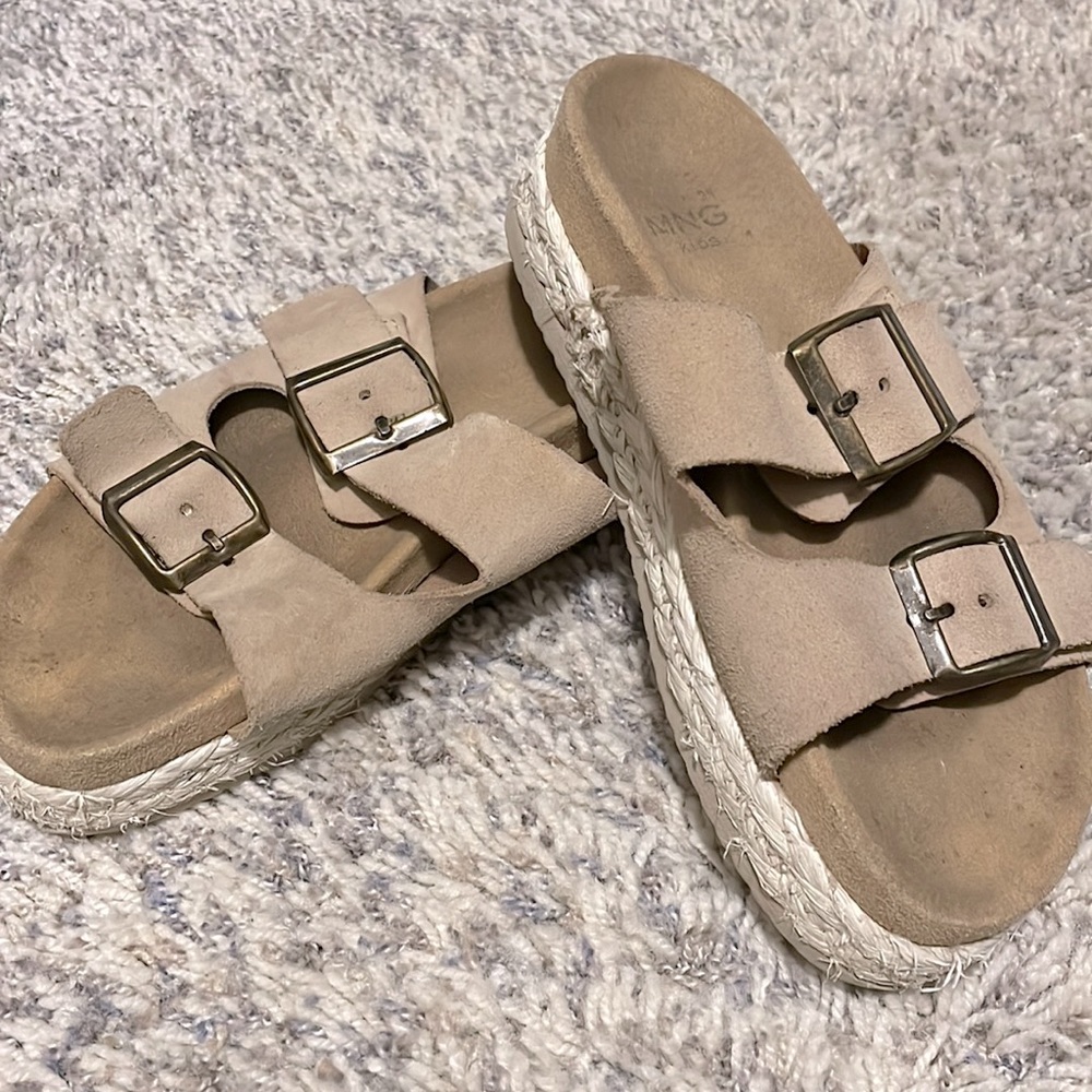 Tan leather and rope sandals.